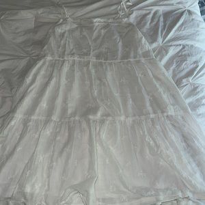 Adorable white flowy dress! Super cute and stylish! Has adjustable straps!